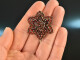 Around 1890! Sparkling star brooch with garnets metal gold plated