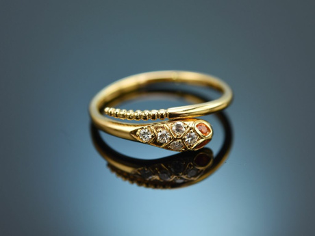 Pretty snake ring with diamonds and mandarin garnet 750 gold