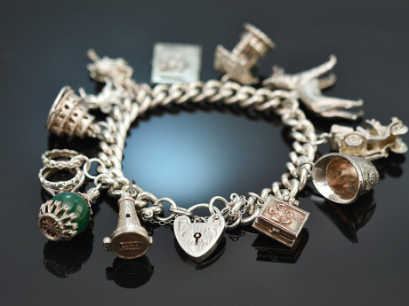 London around 1975! Beautiful charm bracelet with twelve silver 925 charms