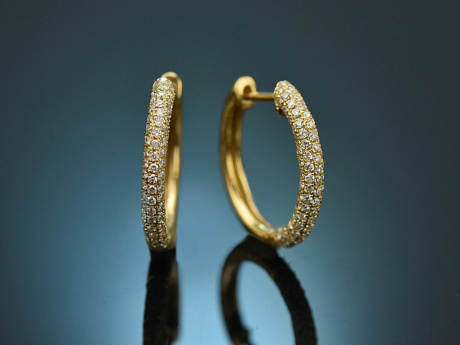 Oval hoop earrings with diamonds 0.74 carats, made of 750 gold.