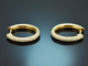 Oval hoop earrings with diamonds 0.74 carats, made of 750 gold.